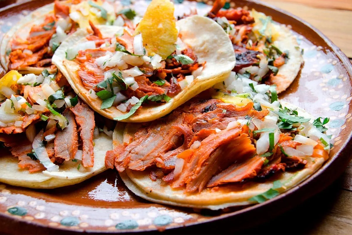 El exquisito origen de los tacos al pastor